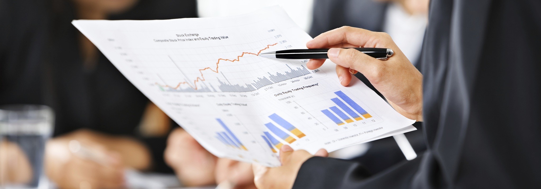 Examining Graphs With Other People On Background